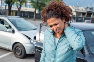 woman experiences whiplash and neck injuries after a car accident