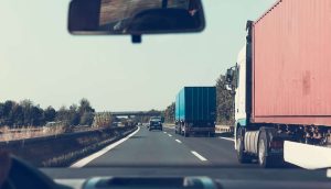 chameleon trucking companies truck drives down a freeway