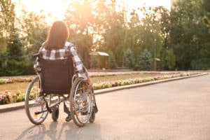 woman suffering from paralysis in a wheelchair