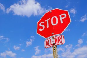stop sign stops an illegal left-turn accident or a rear-end accidents from occurring